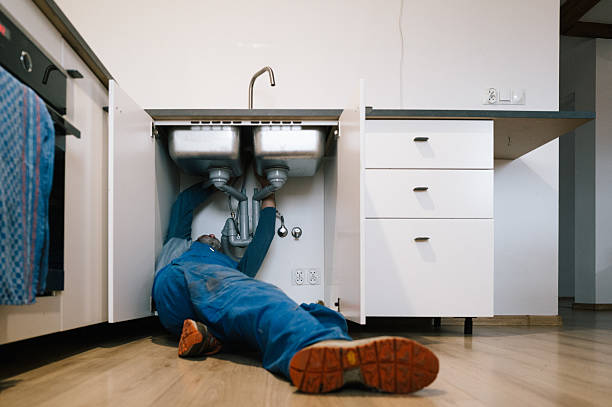 Professional Drain Cleaning technician working in Leoma, TN